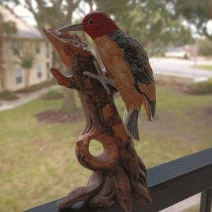 Vintage porcelain woodpecker sculpture